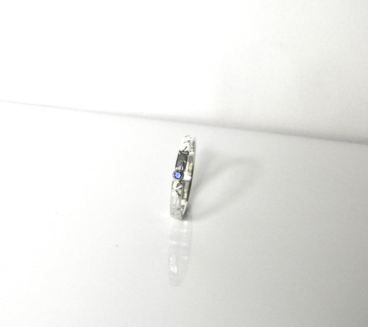 Petal and butterfly wings with yellow gold bezel and blue sapphire