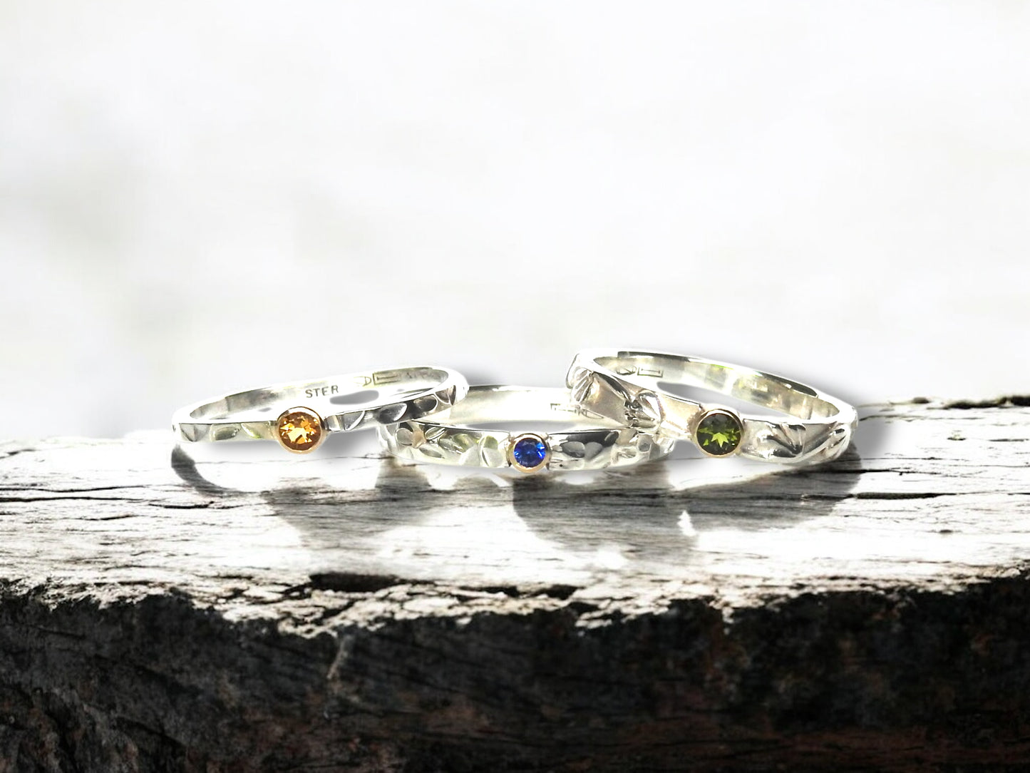 Petal and butterfly wings with yellow gold bezel and blue sapphire