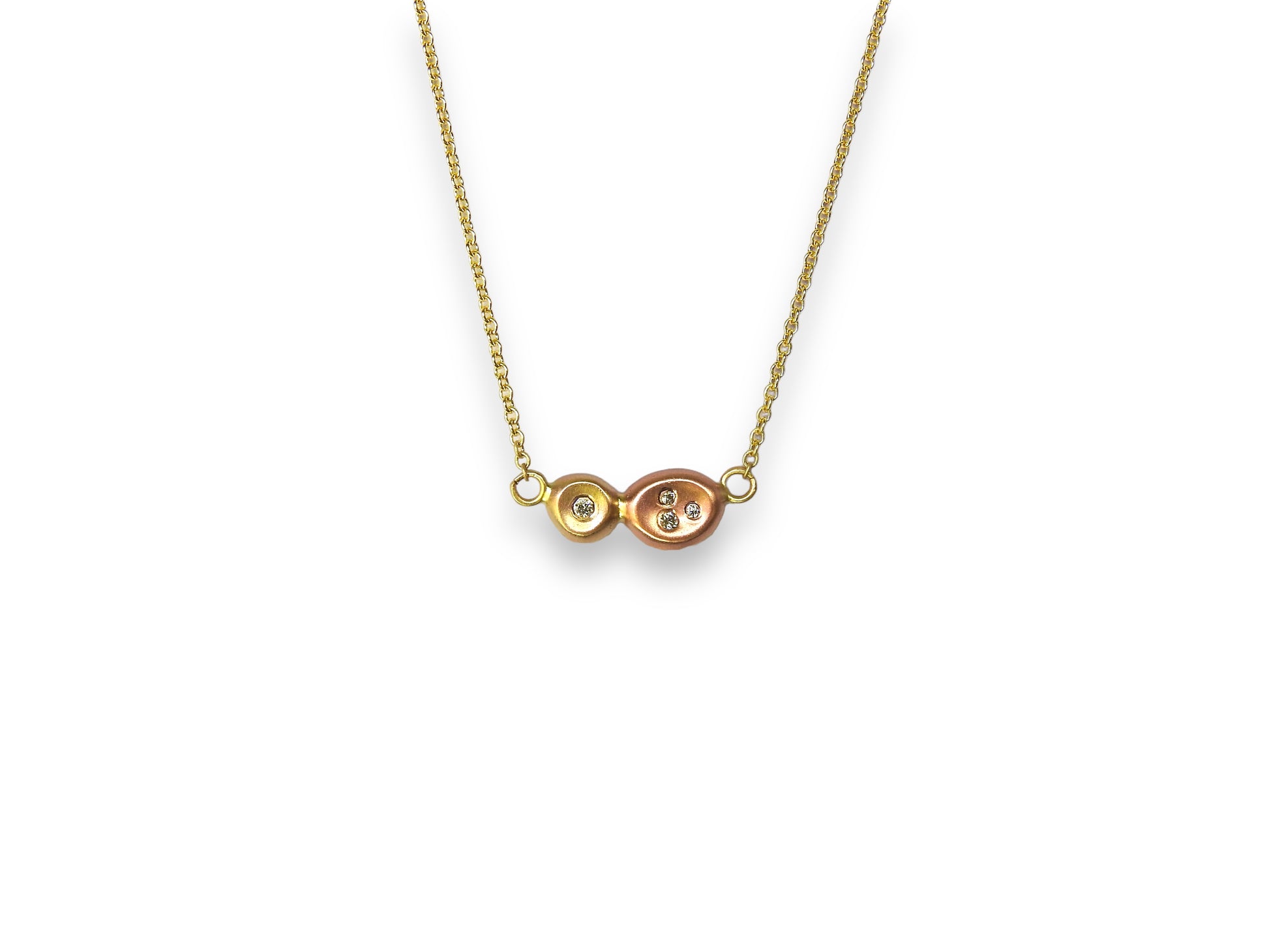 Diamonds in the rough: two tone yellow, and red gold organic pebbles, with scattered diamonds gypsy set in, handing on an 18"  10kt yellow gold cable chain, by ZEALmetal, Nicole Horlor, in Kingston, ON, Canada