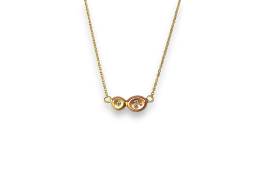 Diamonds in the rough: two tone yellow, and red gold organic pebbles, with scattered diamonds gypsy set in, handing on an 18"  10kt yellow gold cable chain, by ZEALmetal, Nicole Horlor, in Kingston, ON, Canada