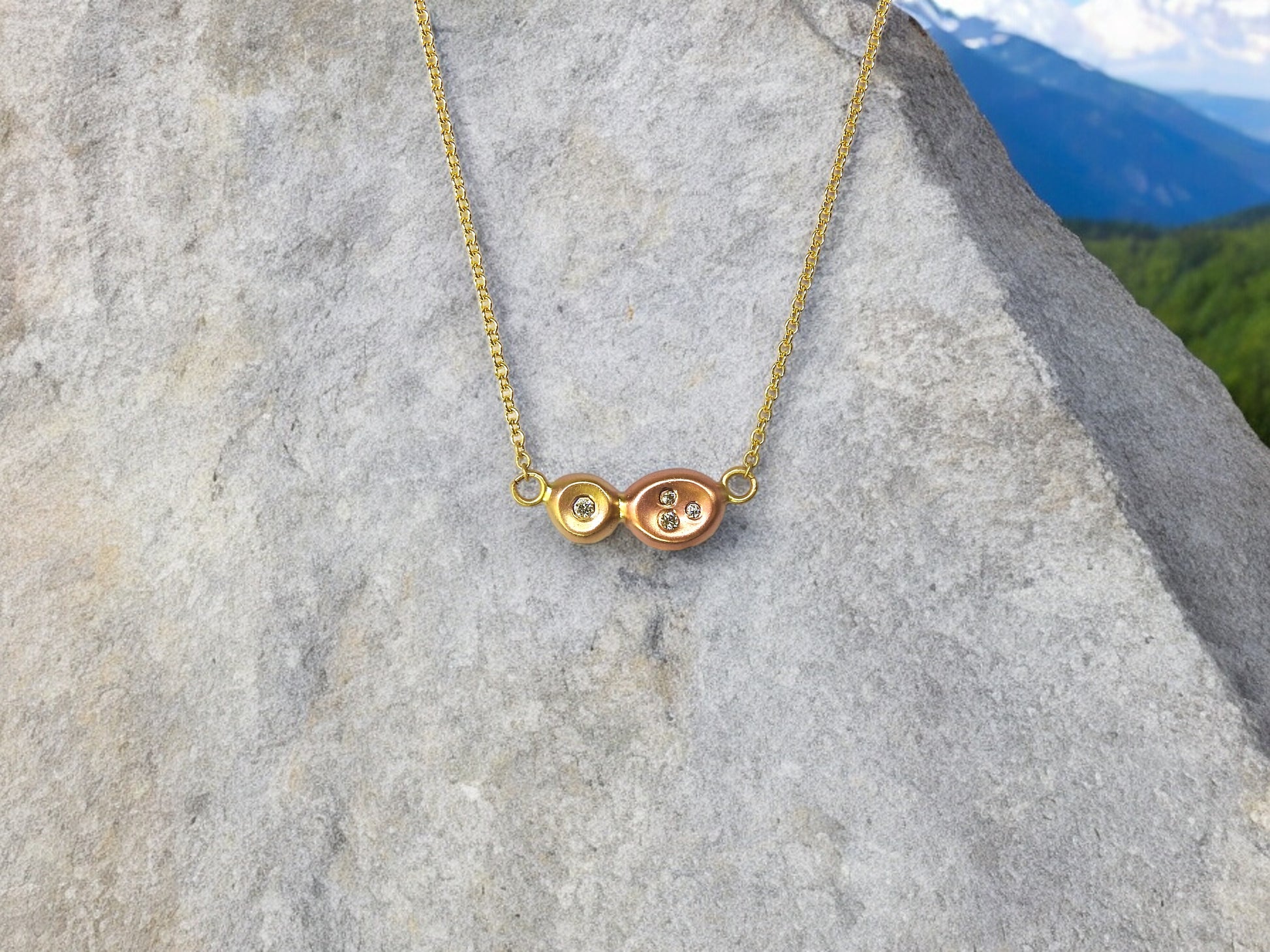 Diamonds in the rough: two tone yellow, and red gold organic pebbles, with scattered diamonds gypsy set in, handing on an 18"  10kt yellow gold cable chain, by ZEALmetal, Nicole Horlor, in Kingston, ON, Canada