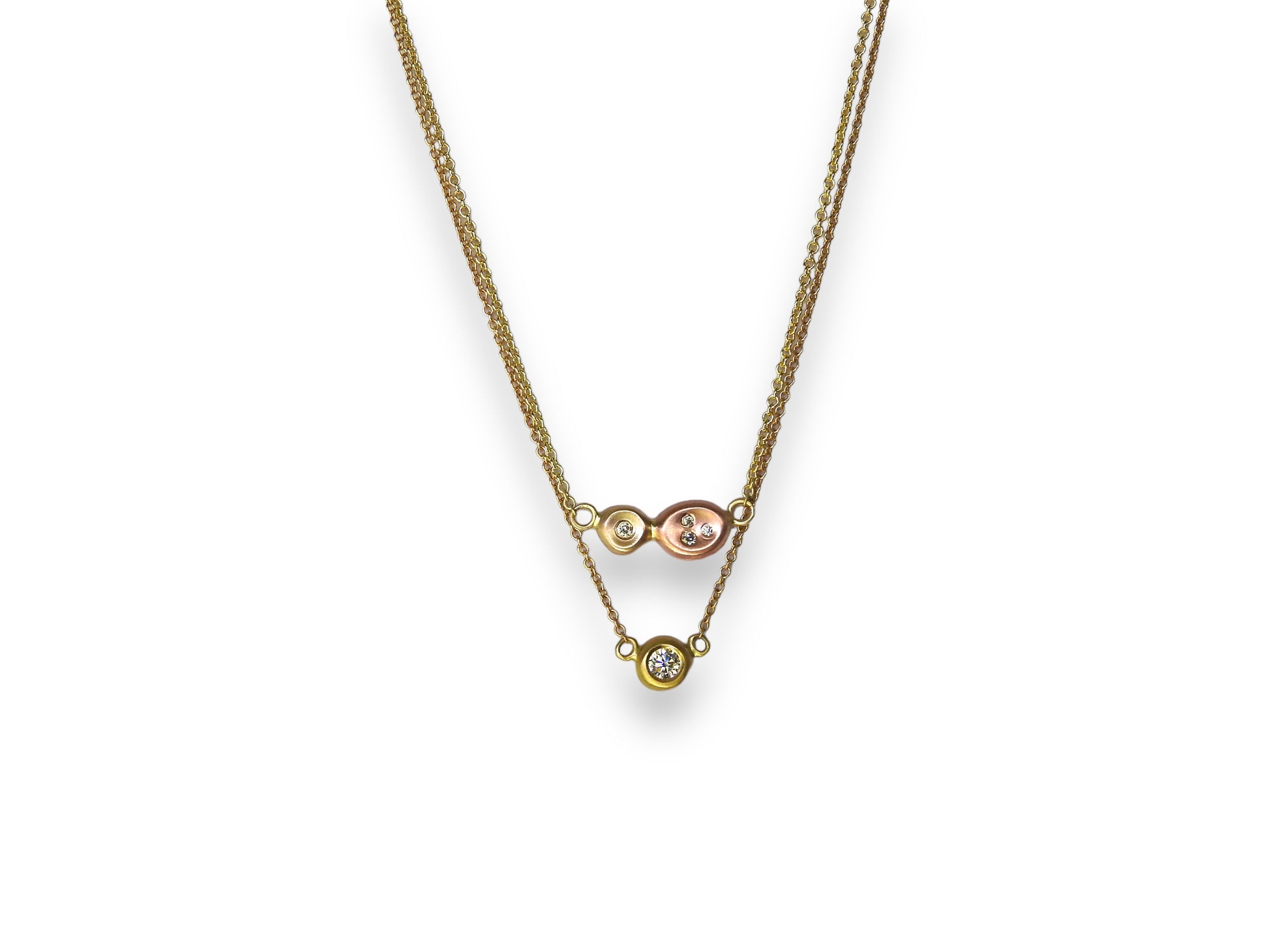 Diamonds in the rough: two tone yellow, and red gold organic pebbles, with scattered diamonds gypsy set in, handing on an 18"  10kt yellow gold cable chain, by ZEALmetal, Nicole Horlor, in Kingston, ON, Canada
