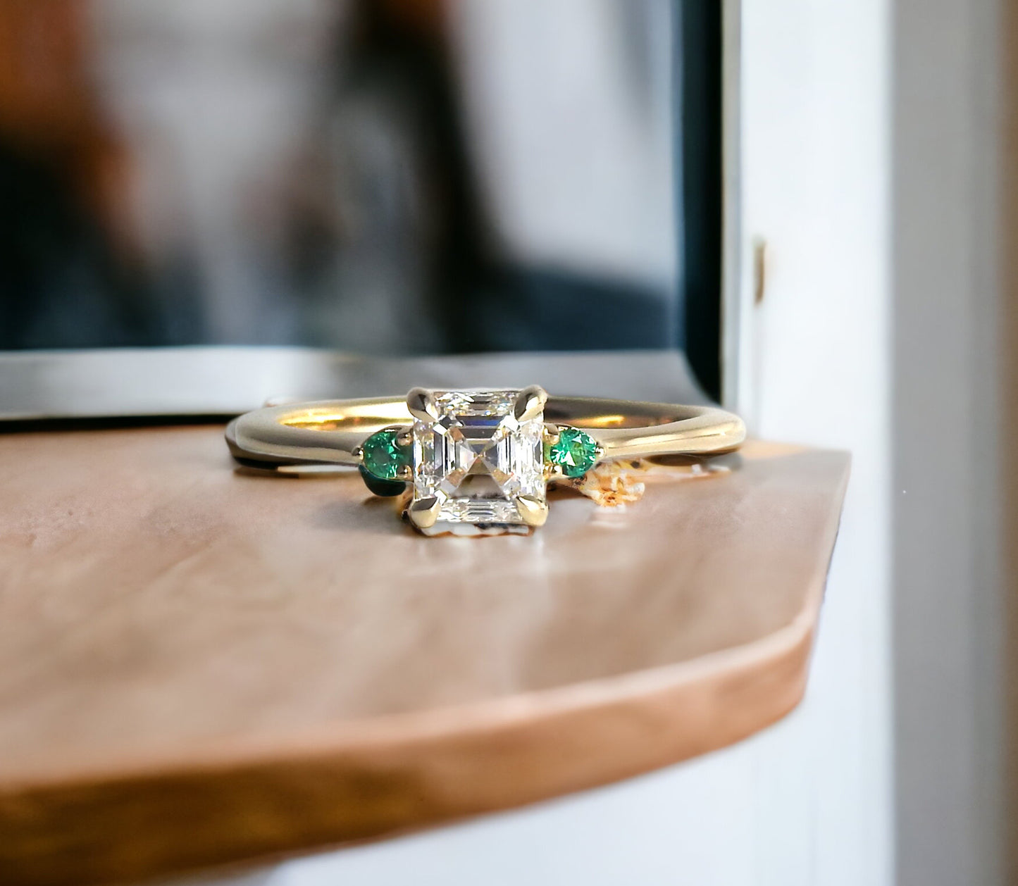 Bespoke engagement ring with an asscher cut diamond and accent emeralds in 14kt yellow gold, by ZEALmetal, Nicole Horlor, in Kingston, ON, Canada