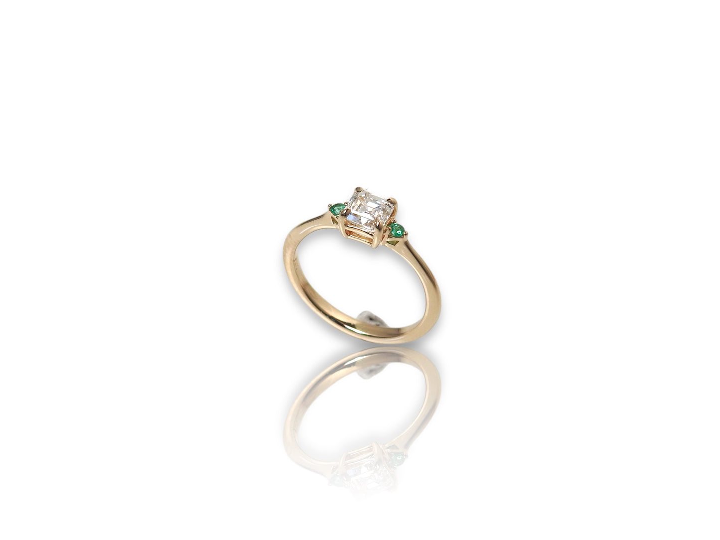 Bespoke engagement ring with an asscher cut diamond and accent emeralds in 14kt yellow gold, by ZEALmetal, Nicole Horlor, in Kingston, ON, Canada
