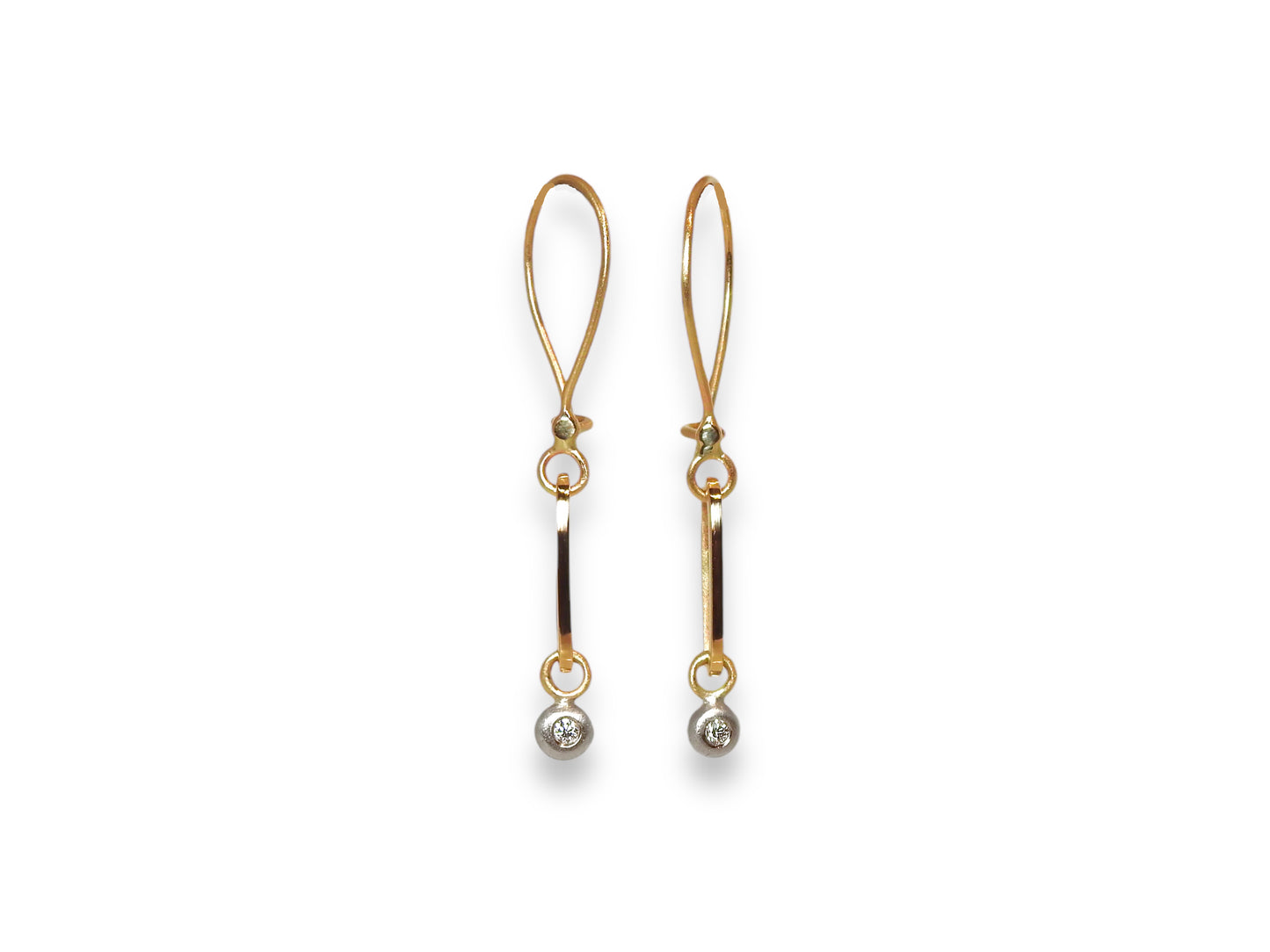 14kt yellow and white gold earrings, ZEALmetal hoop style wires, with elongated, stretched out ovals with white gold pebble dangles set with .02pter x 2 GH VS round brilliant cut diamonds