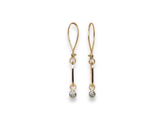 14kt yellow and white gold earrings,  ZEALmetal hoop style wires, with elongated, stretched out ovals with white gold pebble dangles set with .02pter x 2 GH VS round brilliant cut diamonds
