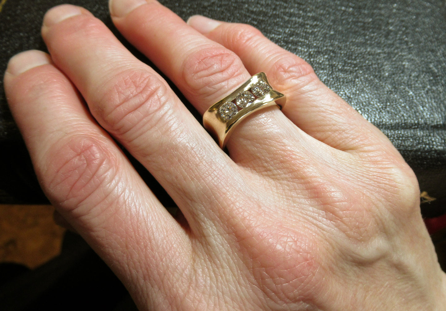 Custom designed and handcrafted Organically you 14kt yellow gold 3 diamond anniversary band. This band was designed around 2 recycled diamonds of Anne’s, and a third added. Canadian, Local, handmade Custom diamond rings by ZEALmetal in Kingston ON.