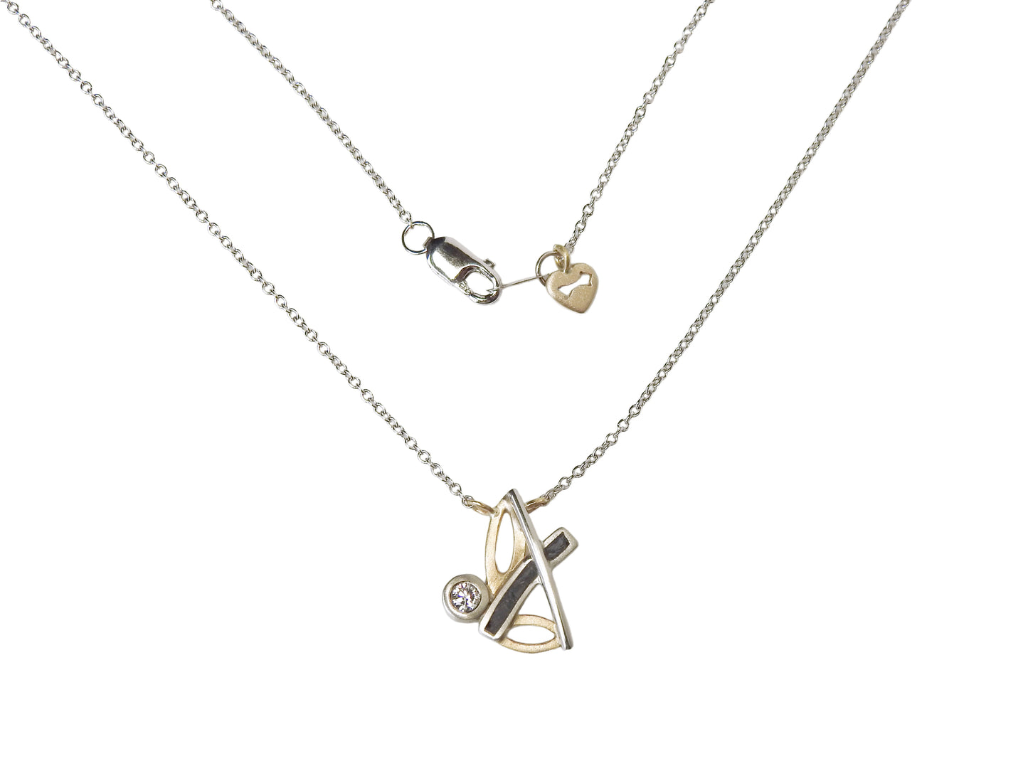 Bespoke 14kt white and yellow gold necklace with limestone inlay and .10 CT CANADAMARK - Hearts & Arrows diamond F+ VS, small 14kt yellow gold heart and arrow tag near clasp.