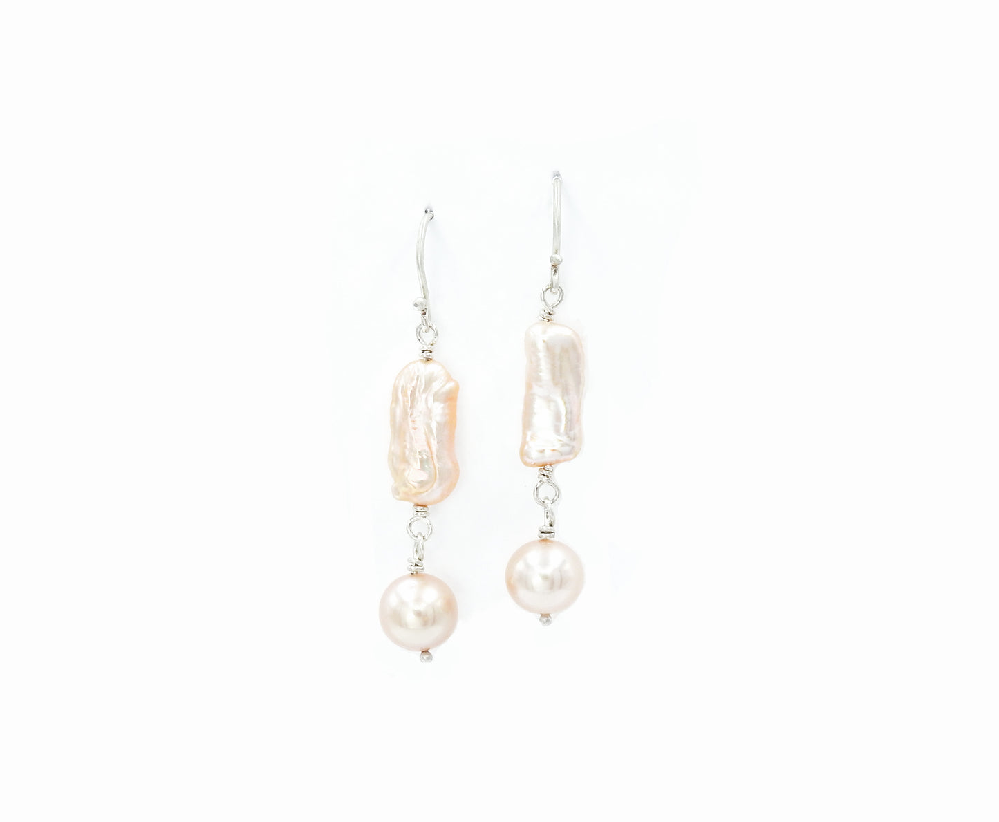 Elongated baroque cultured pearls tied with sterling silver wire, with 8.5mm round natural soft pink pearl drops, on sterling silver Shepard hooks. By ZEALmetal, Nicole Horlor, Kingston, ON, Canada