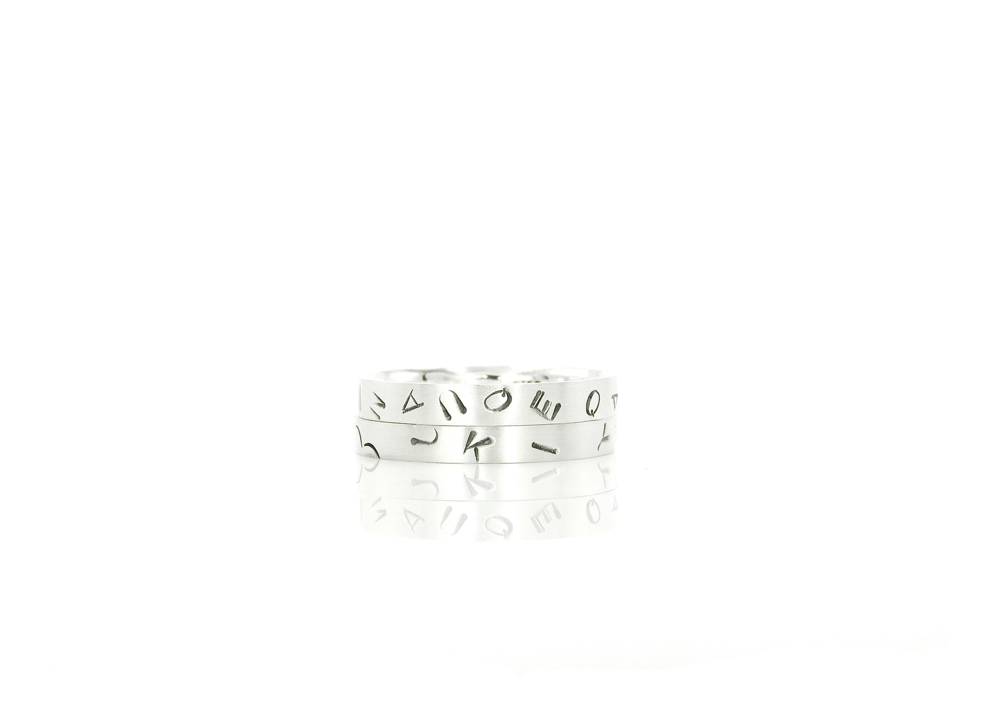 Graffiti stacker rings made from 100% recycled silver and gold, by ZEALmetal, Nicole Horlor, in Kingston, ON, Canada