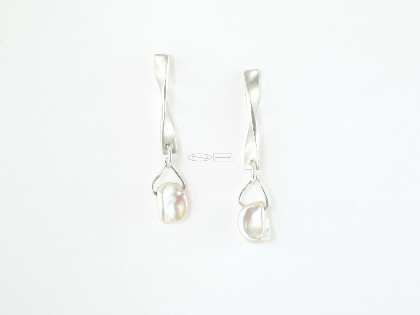 ZEALmetal designs, Canadian made in Kingston ON Iceberg twist ~ Sterling silver twist earrings with matte and high polish finish, unique keshi pearl drops that to me look like little icebergs... Pearl powder can zen you out. Known as a powerful Shen (spirit) stabilizer, it supports mood stability with its soothing and calming nature. Its spirit-building capabilities can help to relieve the uneasiness, nervousness, anxiety and tension associated with occasional stress, leaving you cool, calm and collected.
