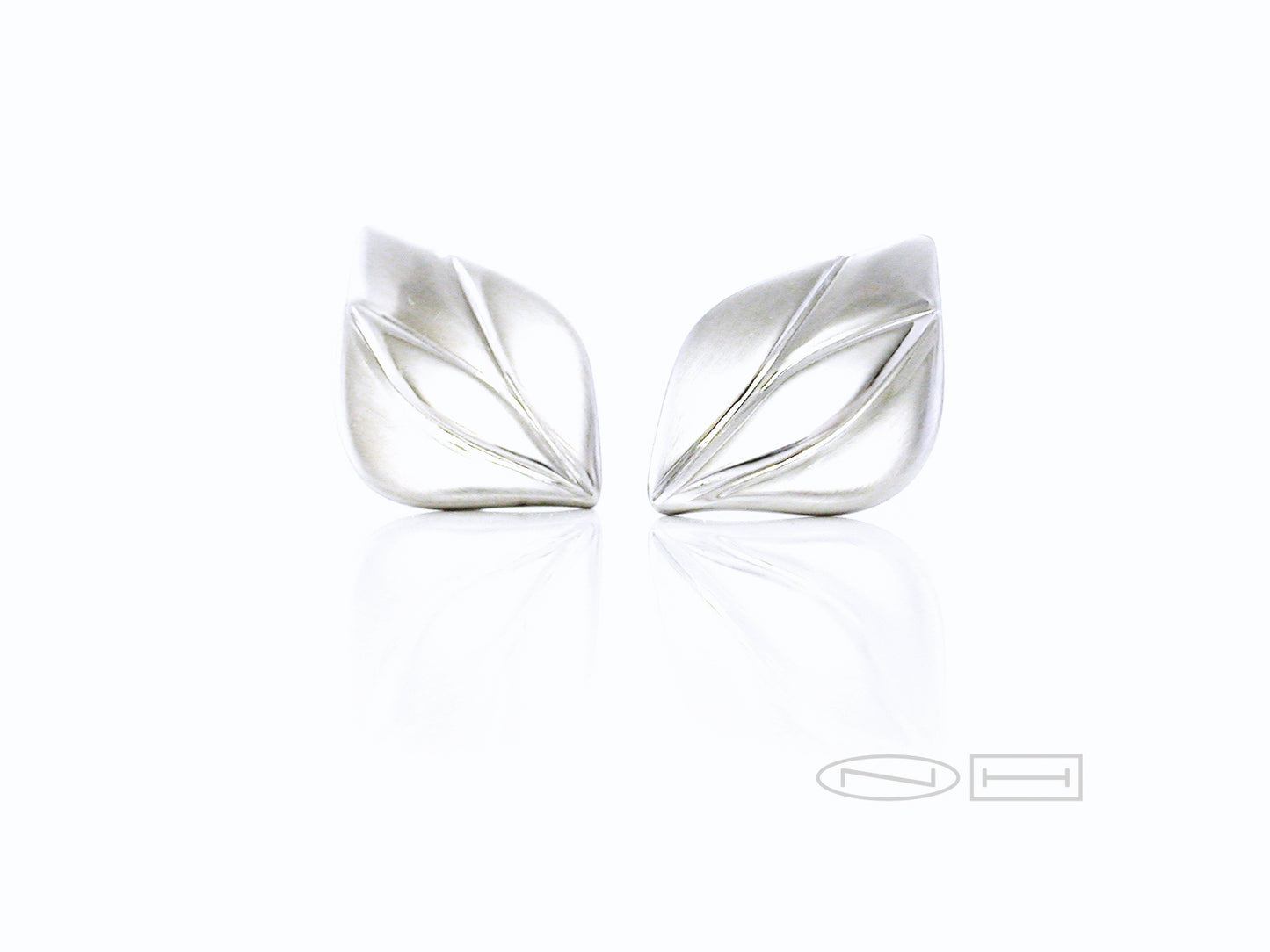 Hand carved stud earrings by ZEALmetal in Kingston ON Canada