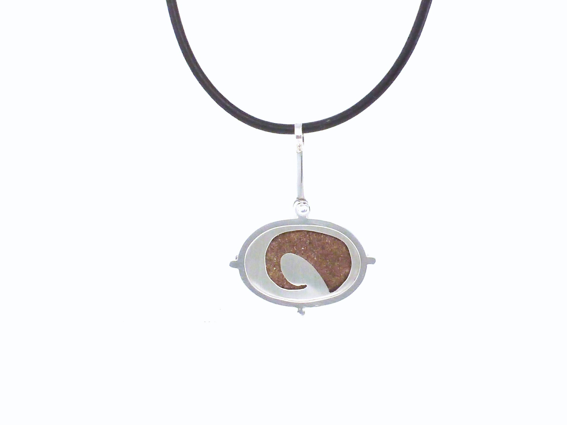 Point no point - sandstone necklace ~  Sterling silver bezelled sandstone pebble found at Point no Point, Sooke, Vancouver Island, BC this is then set in a sterling silver frame clawed setting, on the back has a pierced out wave showing the stone in the back,  By ZEALmetal, Nicole Horlor, in Kingston, ON, Canada