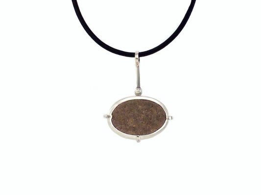 Point no point - sandstone necklace ~  Sterling silver bezelled sandstone pebble found at Point no Point, Sooke, Vancouver Island, BC this is then set in a sterling silver frame clawed setting, on the back has a pierced out wave showing the stone in the back,  By ZEALmetal, Nicole Horlor, in Kingston, ON, Canada