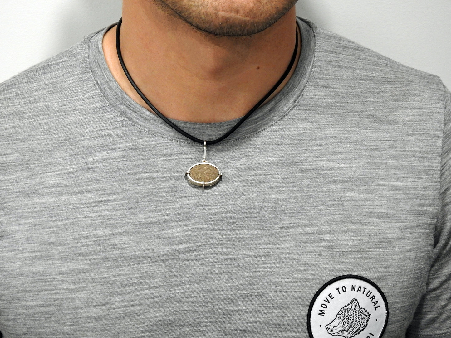 Point no point - sandstone necklace ~ Sterling silver bezelled sandstone pebble found at Point no Point, Sooke, Vancouver Island, BC this is then set in a sterling silver frame clawed setting, on the back has a pierced out wave showing the stone in the back, By ZEALmetal, Nicole Horlor, in Kingston, ON, Canada