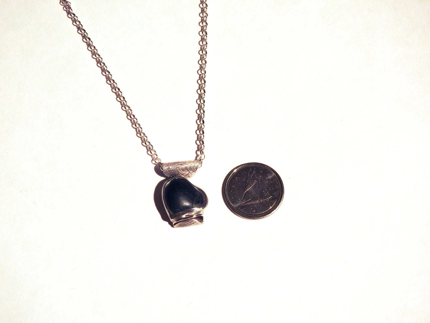 Handmade jewellery by ZEALmetal, Nicole Horlor, in Kingston, ON Canada, Unique pebble necklace from Point not Point, Victoria, British Columbian Edit alt text