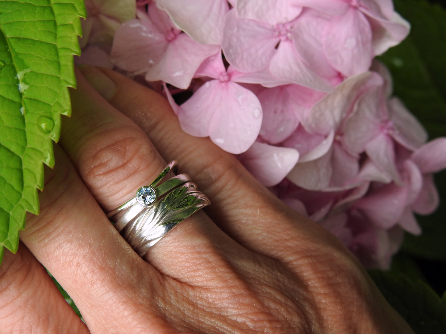 Ripple ring with sky blue topaz