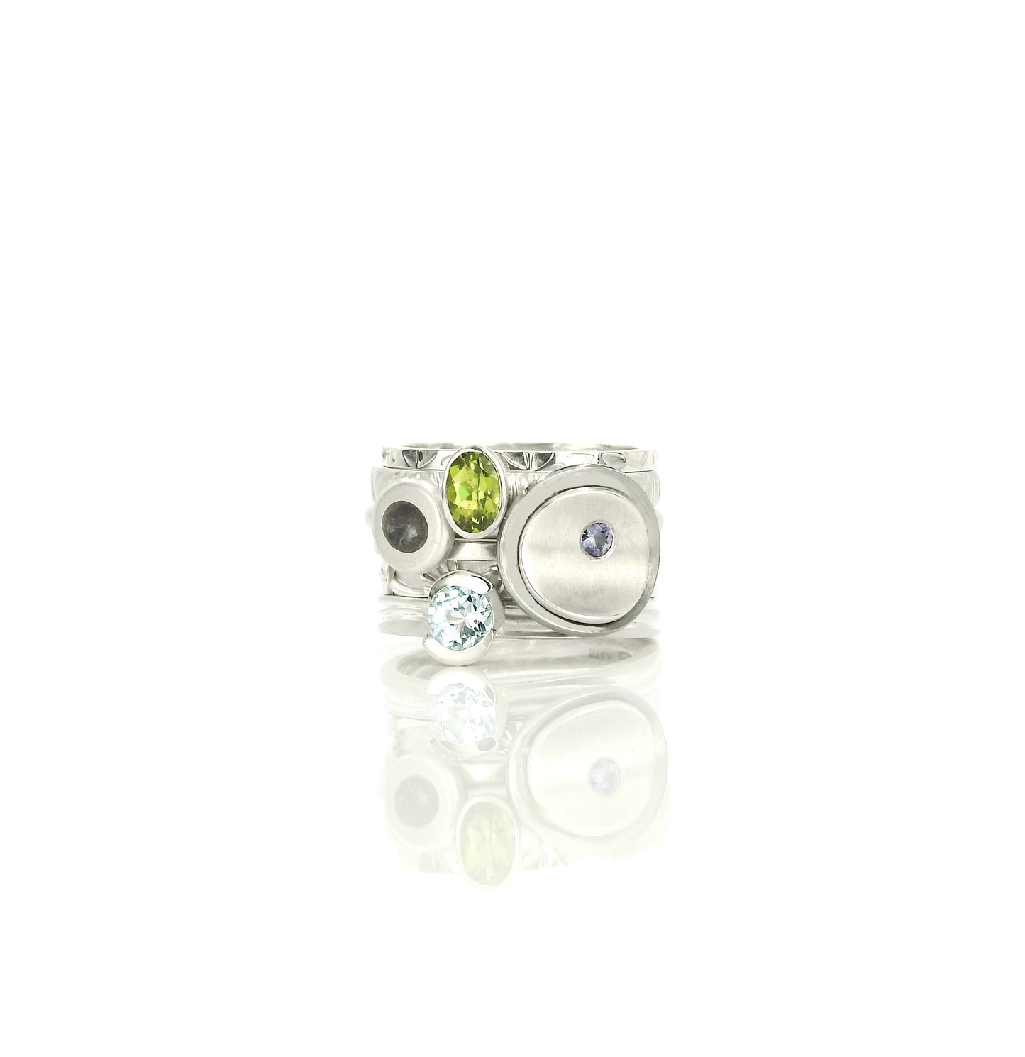 Limestone inlay pebble stacker ring, peridot stacker ring, sky blue topaz stacker ring, blossom stacker ring, leaf stacker ring, by ZEALmetal, Nicole Horlor, in Kingston, ON, Canada