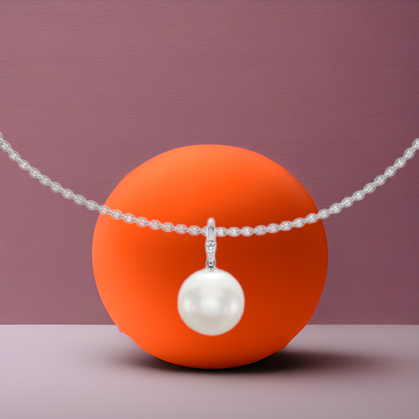 Gorgeous elegant classic 12mm round pearl pendant in 14kt white gold with a unique twist and added CANADAMARK - HEARTS & ARROWS diamond, on an 18kt white gold 2.2mm classic heavy weight, solid 16" cable chain, by ZEALmetal , Nicole Horlor, in Kingston, ON, Canada