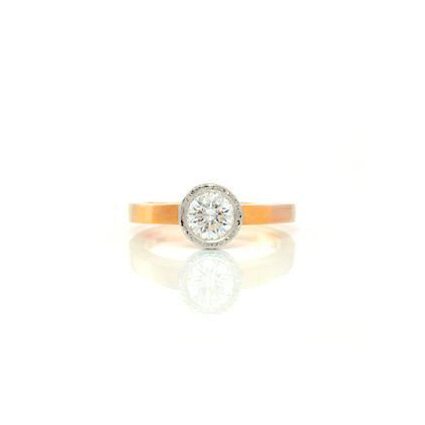 Planished bezel, classic, simple In two tone thin 18kt yellow gold band with 18kt white gold planished bezel. This lovely ring has a beautiful .64pt Canadian diamond, by ZEALmetal, Nicole Horlor, in Kingston, ON Canada