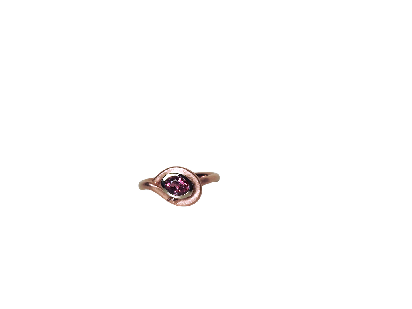 Soft red gold rounded ring, wrapping around a heavy white gold bezel, set with a glowing oval ruby, by ZEALmetal, Nicole Horlor, in Kingston, ON Canada