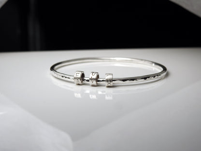 Rhythmic "LOVE" bangle