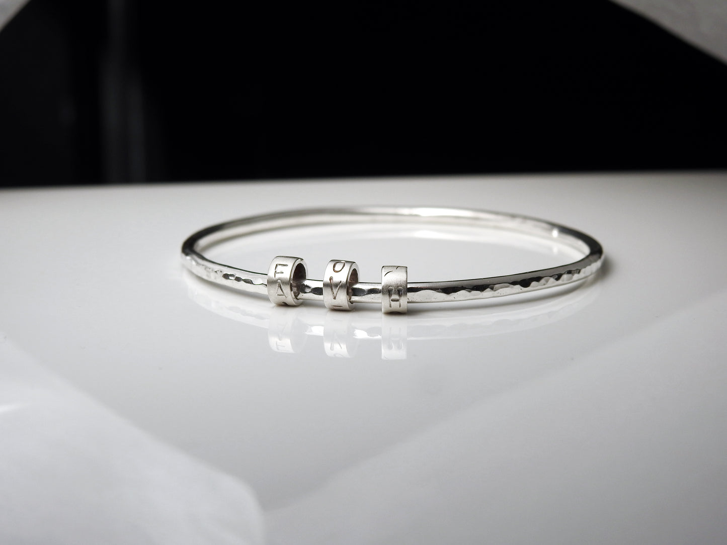 Rhythmic "LOVE" bangle