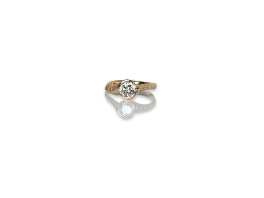 Bespoke engagement ring .70ct round brillant cut CANADAMARK diamond with 7 round brillant cut CANADAMARK diamonds on shoulder sides, in 18kt yellow gold, by ZEALmetal, Nicole Horlor, in Kingston, ON, Canada