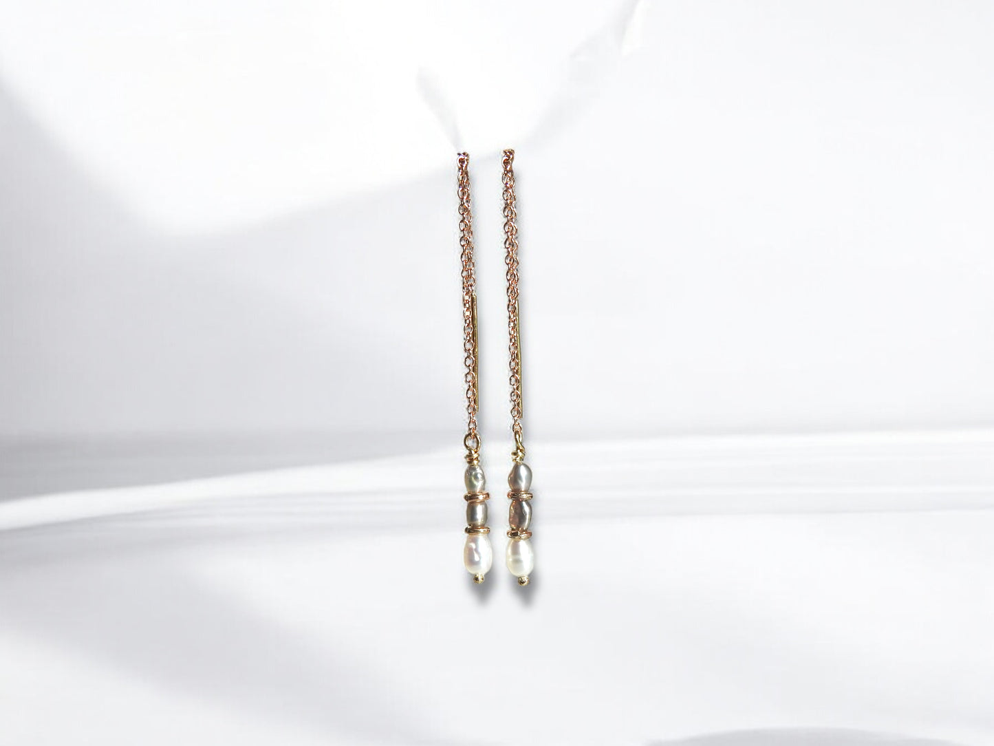 Threaded rice pearl earrings