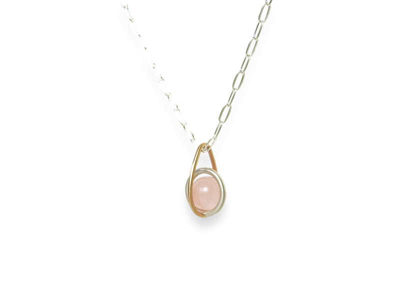 Floating rose quarts sphere pendant with gold drop shape link, sterling silver centre round link gently holding an un-drilled 8.5 mm rose quartz stone, free floating emphasizing space and freedom., by ZEALmetal, Nicole Horlor, in Kingston, ON, Canada