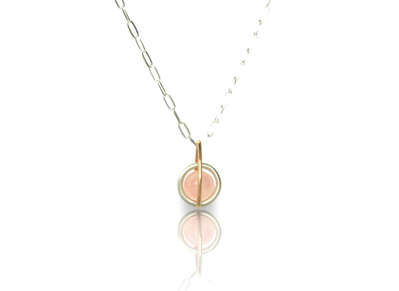 Floating rose quarts sphere pendant with gold drop shape link, sterling silver centre round link gently holding an un-drilled 8.5 mm rose quartz stone, free floating emphasizing space and freedom., by ZEALmetal, Nicole Horlor, in Kingston, ON, Canada