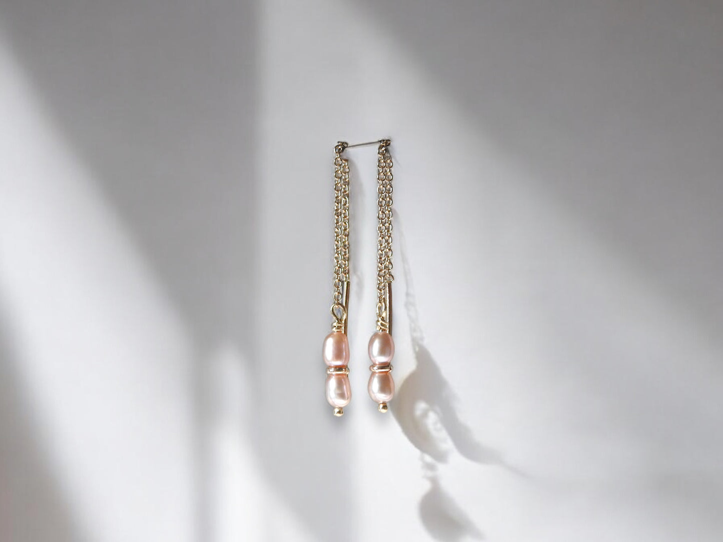 Threaded rice pearl earrings