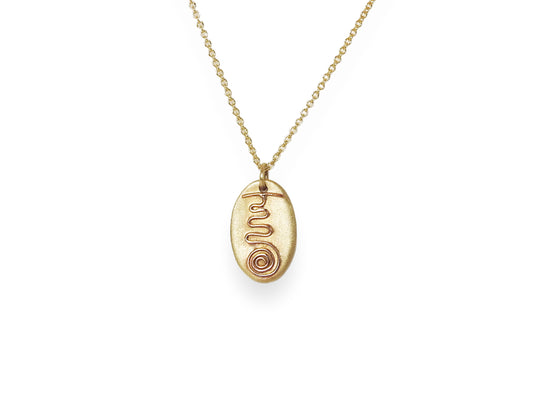 14kt yellow gold pebble pendant with 14kt red gold fire serpent symbol on one side and on the other side is Sei He Ki symbol in yellow gold wire,  by ZEALmetal, Nicole Horlor, in Kingston, ON, Canada