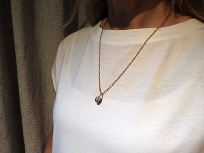 Worldly perspective: new pendant added to the Astral collection . 14 kt yellow gold band within sterling silver wire drop shape holding a free floating worldly looking sodalite undrilled sphere bead.   on 14kty 18" cable chain, by ZEALmetal, Nicole Horlor, in Kingston, ON, Canada