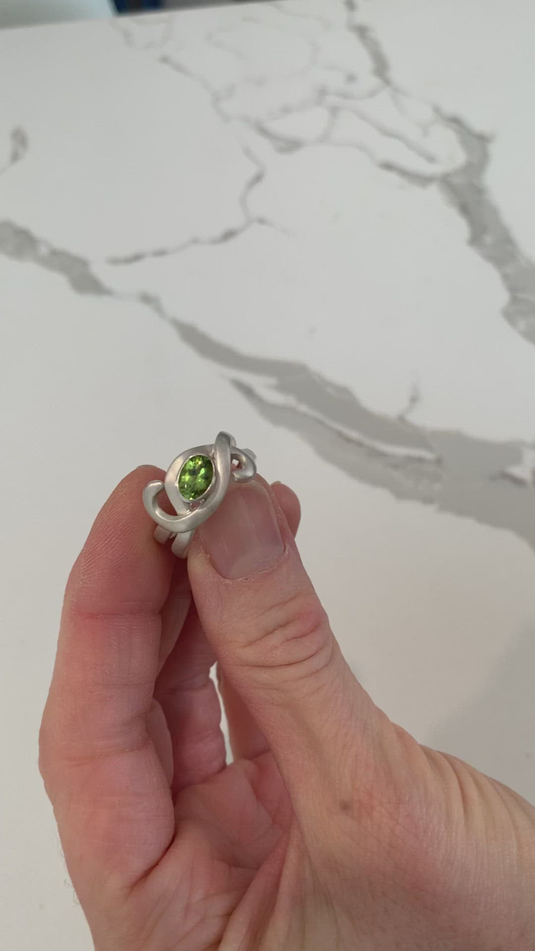Video detail of peridot enfoldment ring by ZEALmetal, Nicole Horlor, in Kingston, ON, Canada