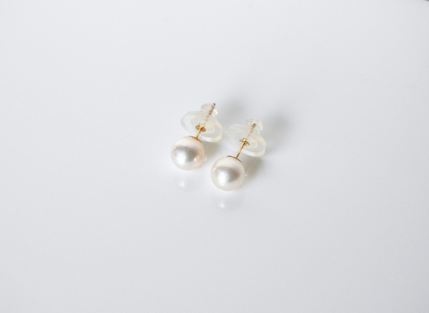 Simple classic and stunning akoya pearl studs with 14kt yellow gold cup post and 8.7mm disc silicone grip friction backs, by ZEALmetal, Nicole Horlor, in Kingston, ON Canada