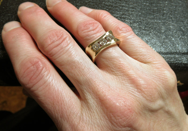 Custom designed and handcrafted Organically you 14kt yellow gold 3 diamond anniversary band. This band was designed around 2 recycled diamonds of Anne’s, and a third added.  Canadian, Local, handmade Custom diamond rings by ZEALmetal in Kingston ON.