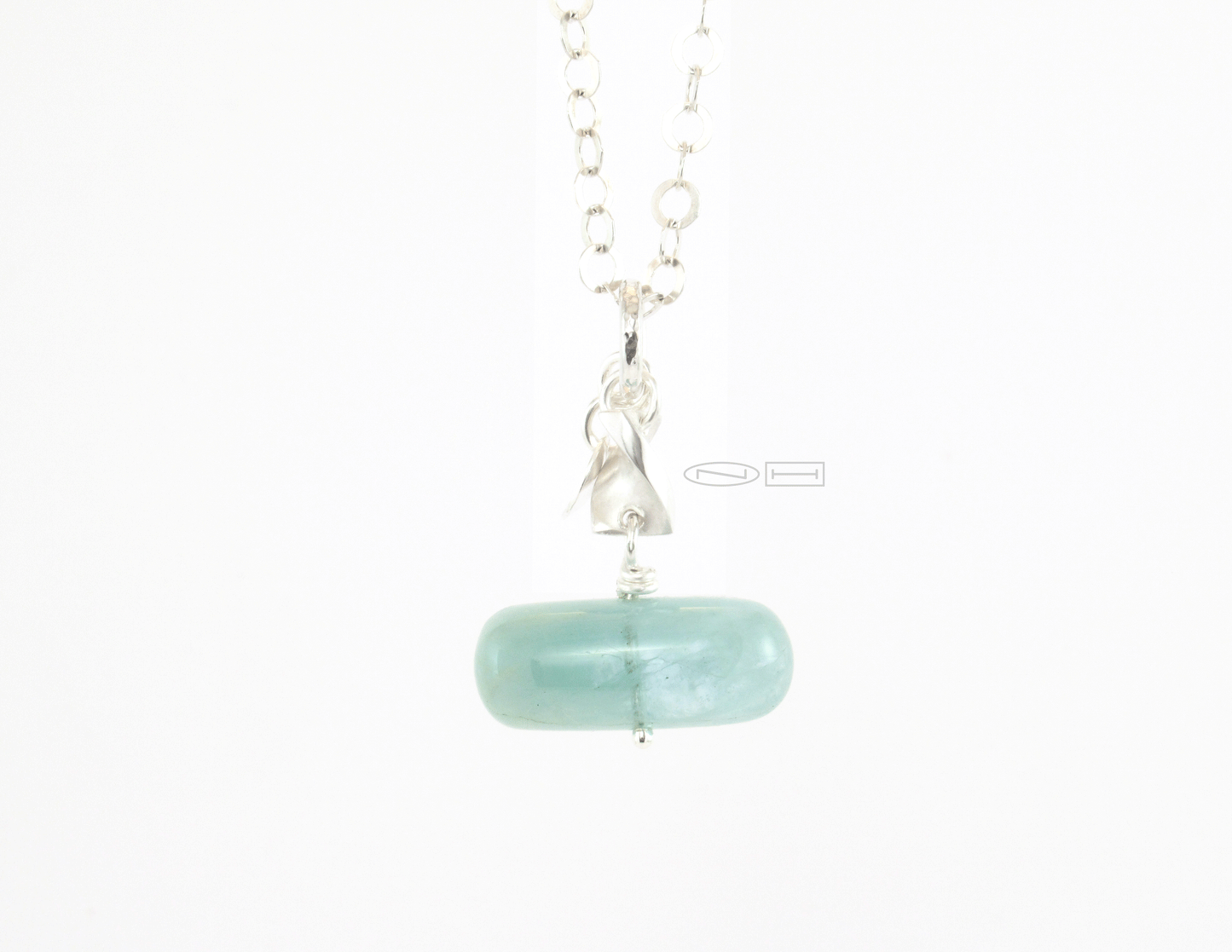 Stackable power pendants ~ Aquamarine pebble with a sterling silver twist, matte and high polish finish, on a sterling silver planished bail, with NH logo tag. Canadian handmade in Kingston ON