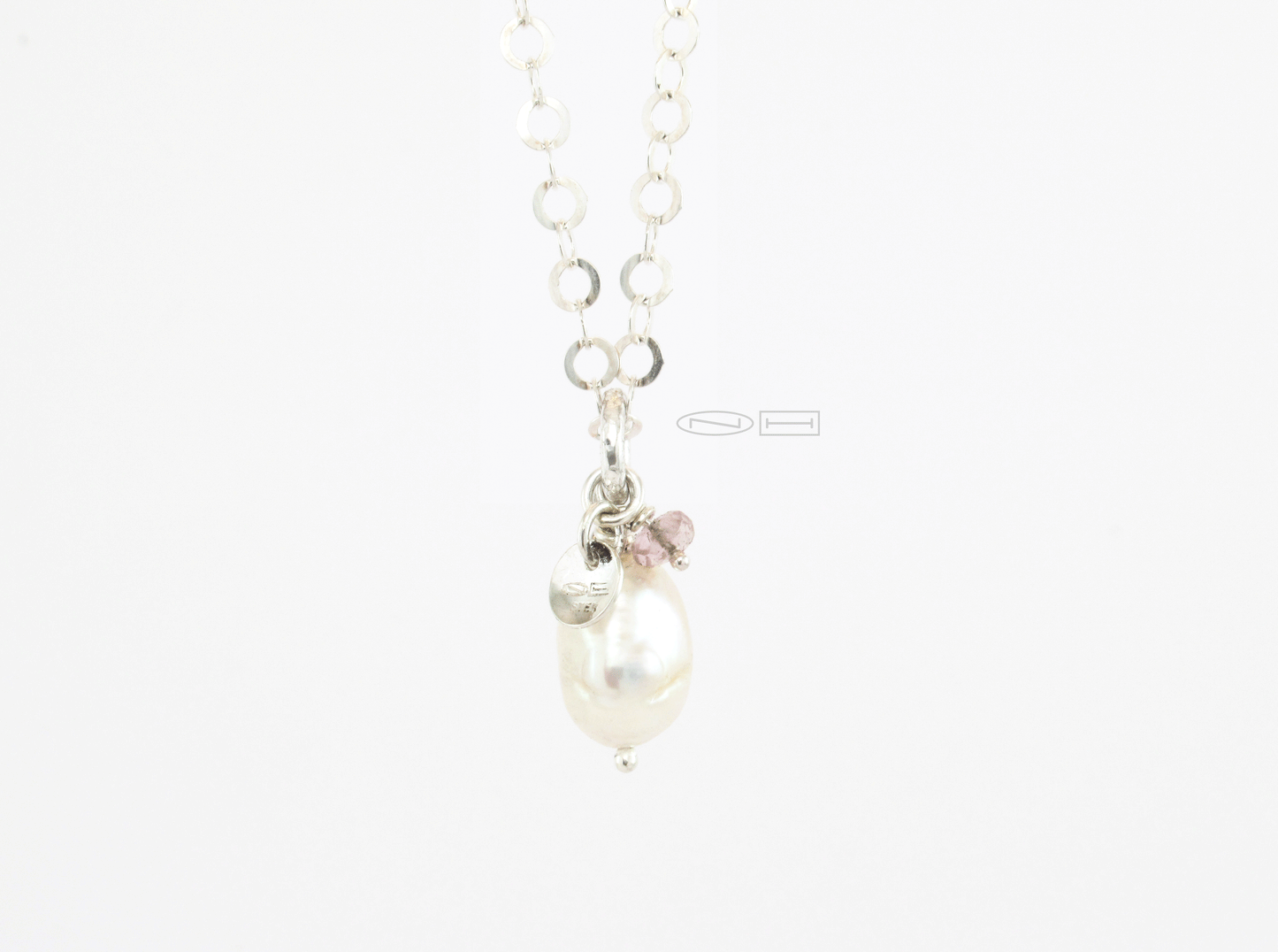 Stackable power pendants ~ White Baroque pearl ~ , handmade sterling silver planished bail with 13x9 unique white baroque pearl, small facetted tourmaline bead and NH logo tag.  Canadian handmade in Kingston ON