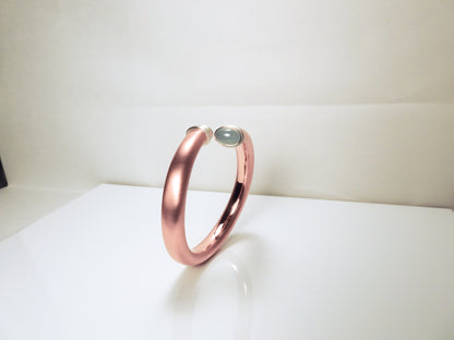 Soft round wrap bangle with sterling silver accent ends and bezels for aquamarine oval cabs. The copper will acquire a lovely patina over time and become uniquely yours. by ZEALmetal, Nicole Horlor, in Kingston, ON Canada