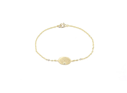 Oval pebble tag bracelet with Canadamark diamond links