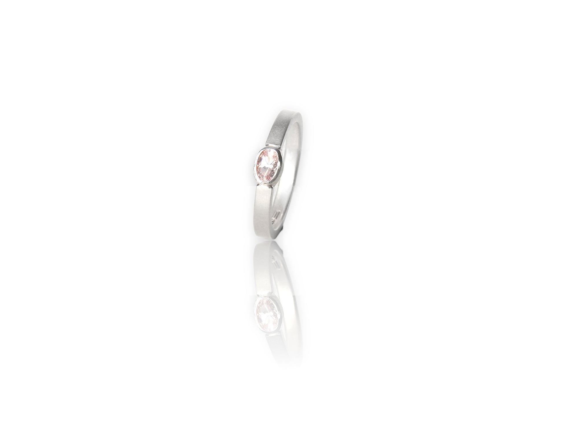 Floating Bezel ~ lovely clean flush bezel setting in band  in sterling silver with 3x5 oval morganite facetted stone. 