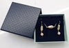 Elongated baroque cultured pearls tied with sterling silver wire, with 8.5mm round natural soft pink pearl drops, on sterling silver Shepard hooks. By ZEALmetal, Nicole Horlor, Kingston, ON, Canada