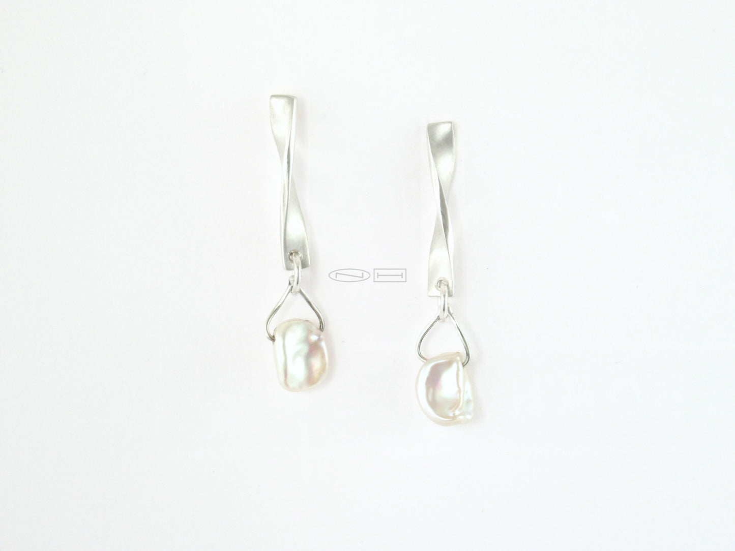 ZEALmetal designs, Canadian made in Kingston ON Iceberg twist ~ Sterling silver twist earrings with matte and high polish finish, unique keshi pearl drops that to me look like little icebergs...   Pearl powder can zen you out. Known as a powerful Shen (spirit) stabilizer, it supports mood stability with its soothing and calming nature. Its spirit-building capabilities can help to relieve the uneasiness, nervousness, anxiety and tension associated with occasional stress, leaving you cool, calm and collected.