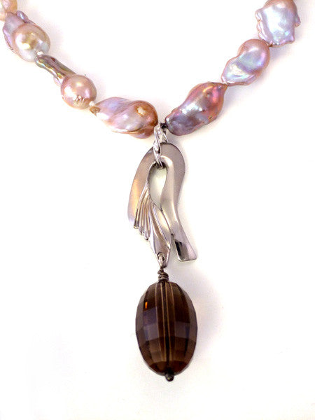 Baroque pearl with steel