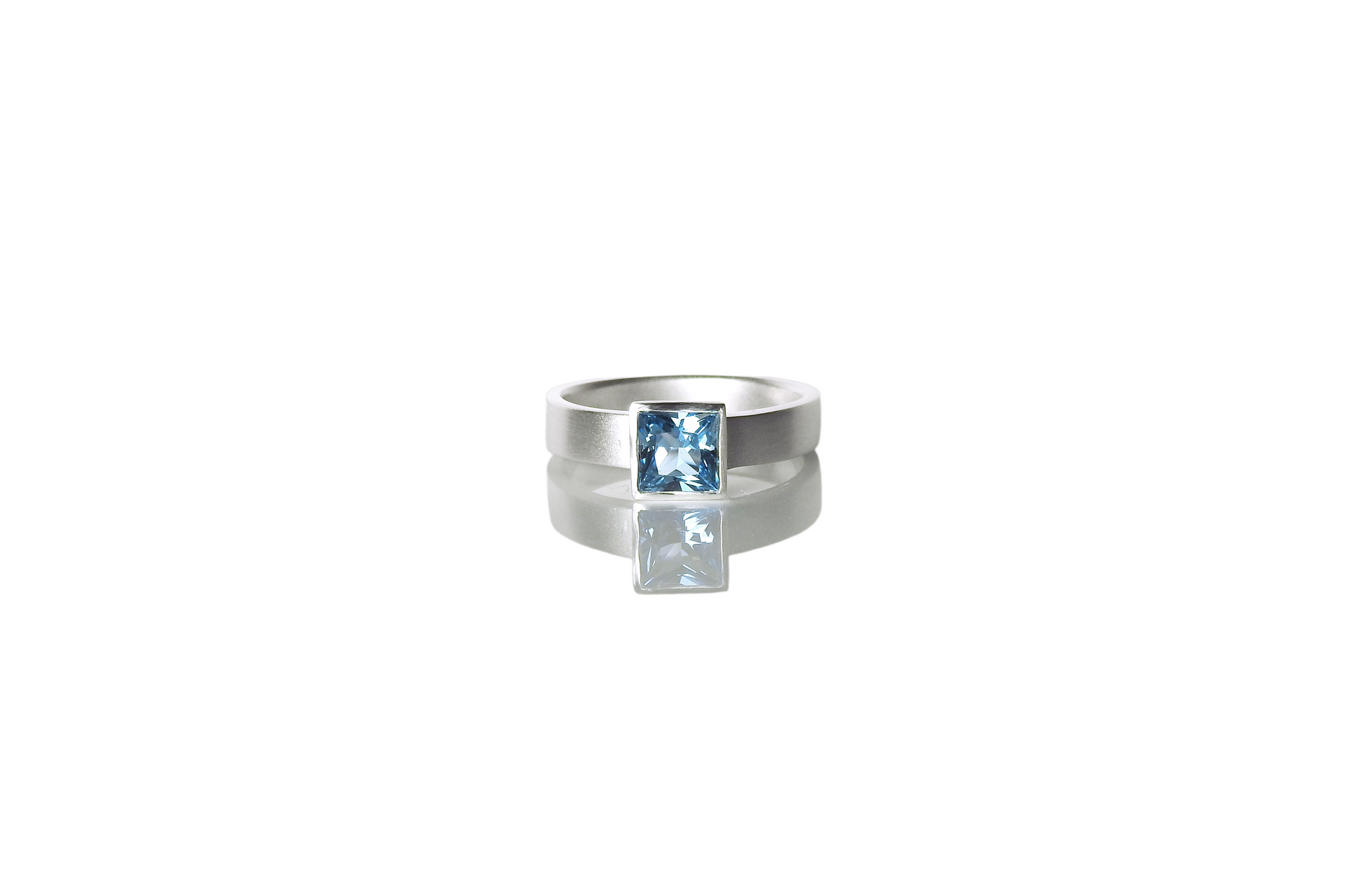 Clean, smooth square, open window bezel ring, with 5mm sky blue princess cut topaz., By ZEALmetal, Nicole Horlor, in Kingston, ON, Canada