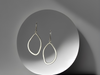 Soft outline of a pebble in sterling silver round wire at the top widening to a flatter outline towards the bottom, by ZEALmetal, Nicole Horlor, in Kingston, ON, Canada