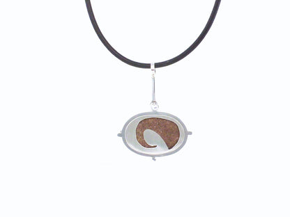  Point no point - sandstone necklace ~  Sterling silver bezelled sandstone pebble found at Point no Point, Sooke, Vancouver Island, BC this is then set in a sterling silver frame clawed setting, on the back has a pierced out wave showing the stone in the back,  By ZEALmetal, Nicole Horlor, in Kingston, ON, Canada