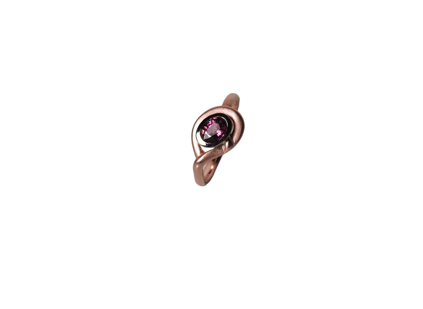 Soft red gold rounded ring, wrapping around a heavy white gold bezel, set with a glowing oval ruby, by ZEALmetal, Nicole Horlor, in Kingston, ON Canada