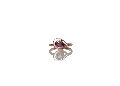 Soft red gold rounded ring, wrapping around a heavy white gold bezel, set with a glowing oval ruby, by ZEALmetal, Nicole Horlor, in Kingston, ON Canada